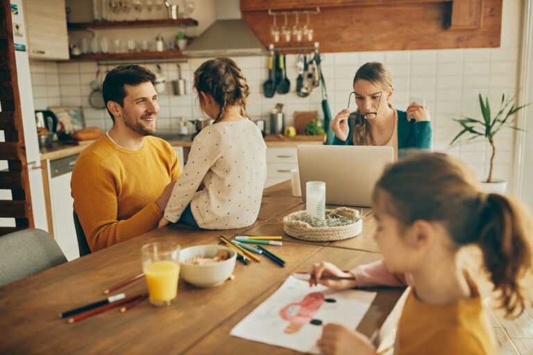 Thermomix® Help & Inspiration 10 Thermomix happy father daughter talking while mother is working laptop home Thermomix Limerick